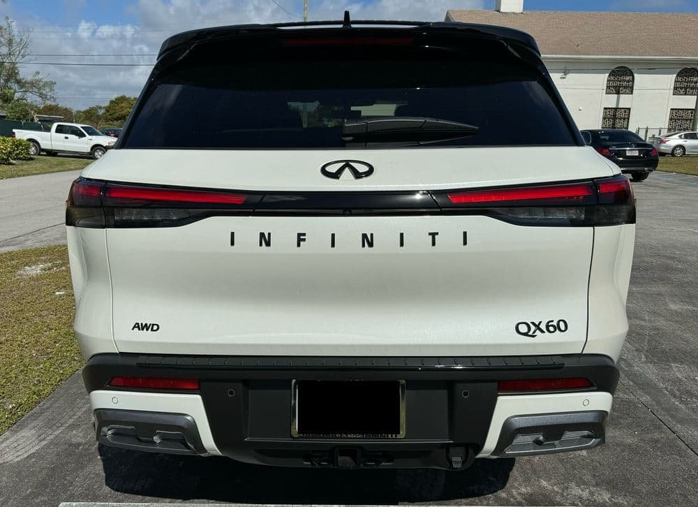 2023 Infiniti QX60 AWD rear view showcasing sleek design and modern features.