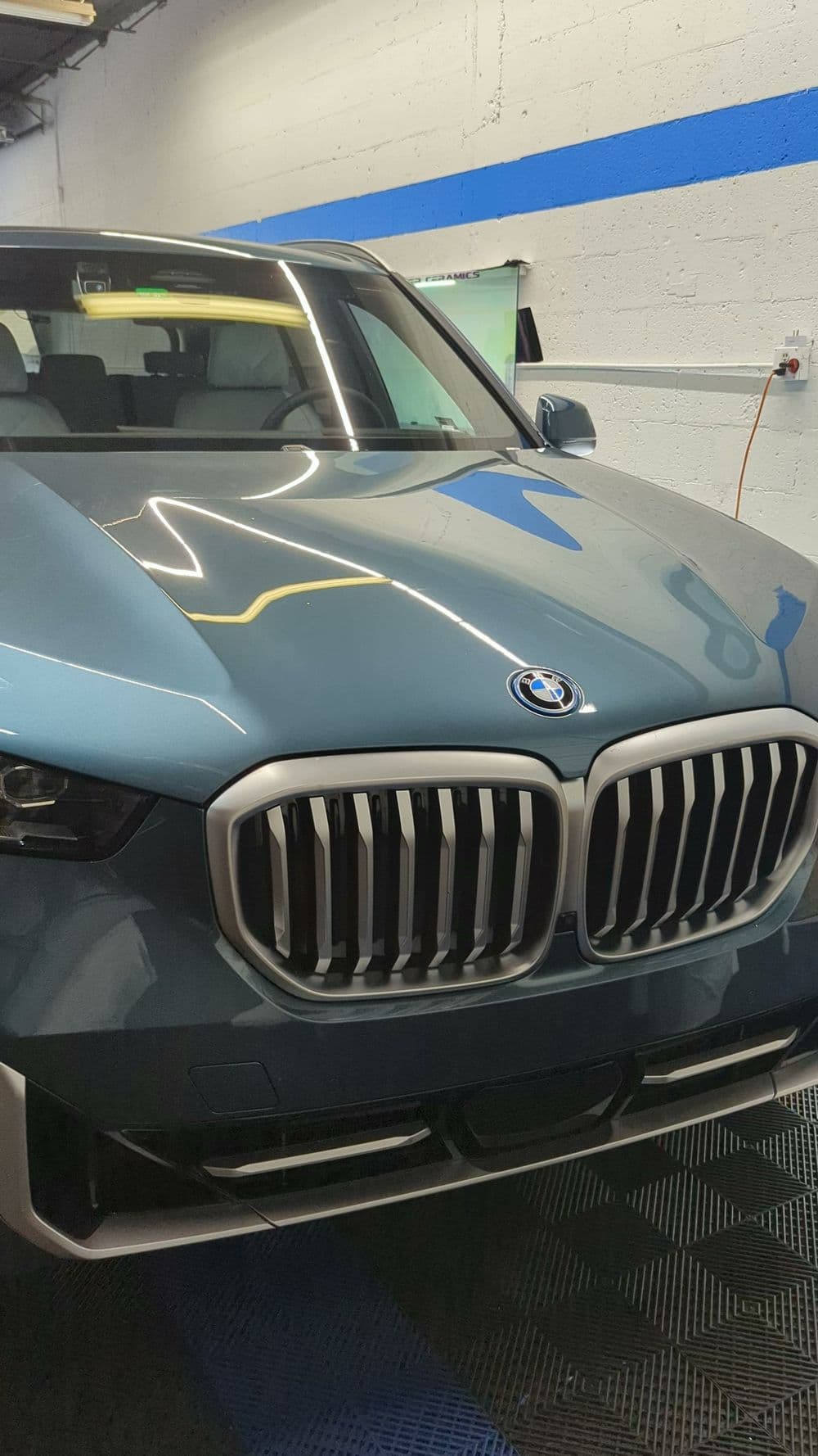 BMW luxury SUV front view with distinctive kidney grille and sleek design.